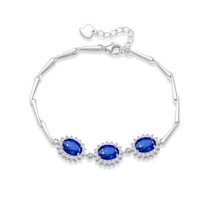 S925 sterling silver bracelet featuring blue sapphire ovals with halo diamond setting