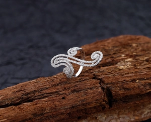 Detailed close-up of S925 sterling silver swirl ring with micro-pave white crystals