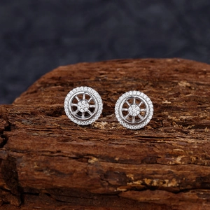 S925 sterling silver dreamcatcher stud earrings with micro-set diamonds on dark wood