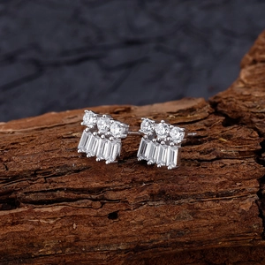 Double-layer sterling silver stud earrings with round and baguette zircon on wood