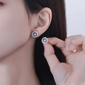 Sparkling S925 sterling silver helm stud earrings with micro-pave crystals on model