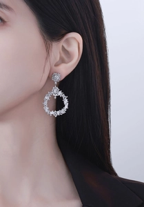 Close-up of S925 sterling silver drop earrings with marquise and pear-cut cubic zirconia