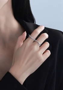 Detail of S925 sterling silver double finger ring with micro-set zircon and star motif