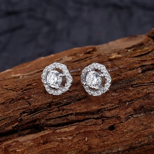 Elegant S925 sterling silver rhombus stud earrings with halo diamonds on natural wood bark