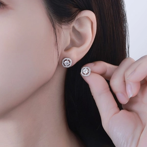 Elegant S925 sterling silver diamond stud earrings with shimmering round stones on earlobe