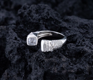 Macro shot of S925 sterling silver bypass ring with square diamond and floral detail