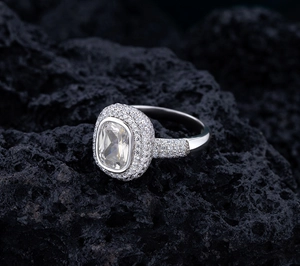 Detailed macro shot of a S925 sterling silver ring with cushion-cut moissanite stone