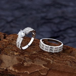 S925 sterling silver stacking ring set with cubic zirconia on textured wood background