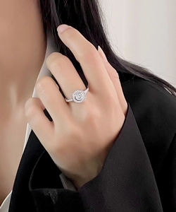 Macro shot of S925 silver double halo ring with round brilliant cut pavé diamonds