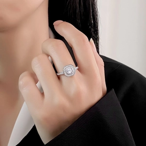 Luxurious S925 sterling silver ring with square halo moissanite worn by a model