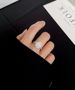 Macro shot of silver S925 ring featuring an oval-shaped sparkling pavé-set crystal dome