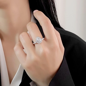 Elegant S925 sterling silver pear-shaped halo ring with micro-pave diamonds on model