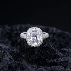 Luxurious S925 sterling silver cushion cut double halo engagement ring on volcanic rock