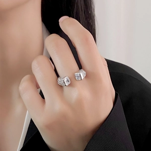Adjustable S925 sterling silver ring featuring dual rectangular cubic zirconia stones