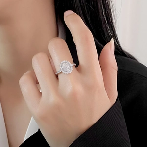 Elegant S925 sterling silver oval ring with pavé diamonds shown on a model's hand