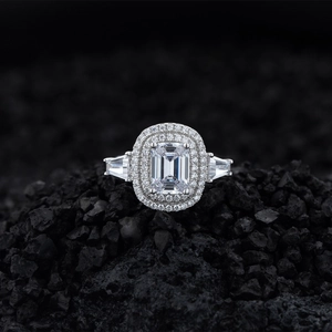 Luxurious S925 silver emerald cut ring with micro-pave diamonds on black stone background