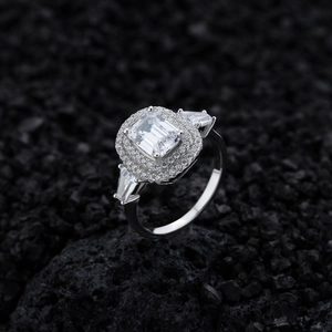 Luxurious S925 sterling silver emerald cut ring with halo setting on volcanic rock