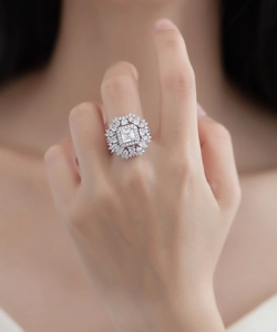 Detailed view of an S925 silver ring featuring a large square gem and radiant halo diamonds