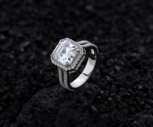 Macro shot of S925 silver ring featuring square halo gemstone and split shank detail