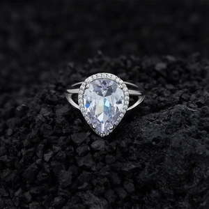 Pear cut teardrop halo ring in S925 sterling silver with split shank on volcanic rock