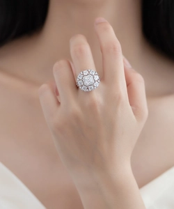 Macro detail of S925 sterling silver ring with square emerald-cut diamond halo