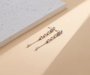 Detail of S925 silver long tassel earrings with colorful square zircon stones