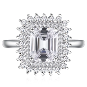 Elegant emerald cut rectangular diamond ring with double halo pavé setting in silver