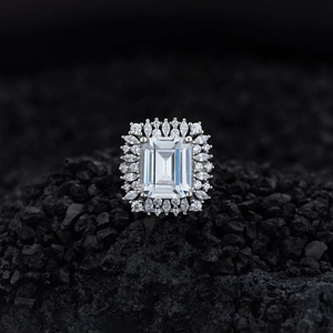 Emerald cut rectangular sparkling silver ring with double halo pavé setting on volcanic rock