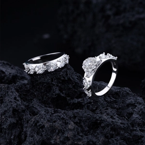 Macro shot of S925 sterling silver leaf ring with zircon stones on volcanic rock
