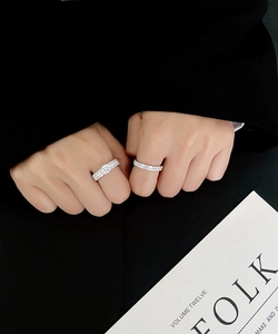 Macro detail of classic 925 sterling silver rings with micro-pave cubic zirconia diamonds