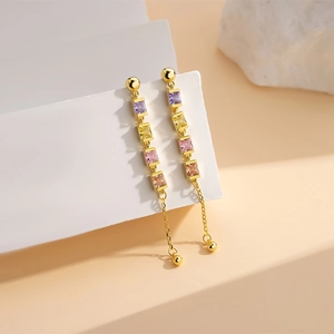 Elegant gold S925 silver fringe earrings with multi-color square gemstones in macro view