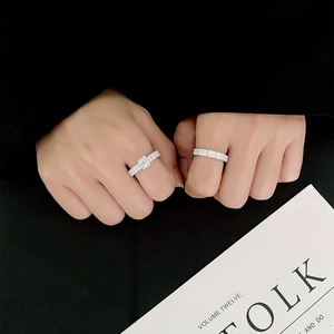 Emerald cut 925 silver ring set with pave zircon bands worn on model hand