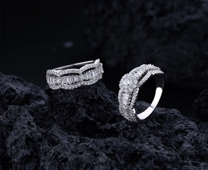 Macro shot of ripple micro-pave S925 silver rings with sparkling cubic zirconia stones