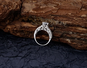 Macro shot of S925 sterling silver ring with micro-pave diamonds and vintage lace pattern