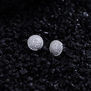 Sparkling S925 sterling silver round micro-pave stud earrings on black textured stone