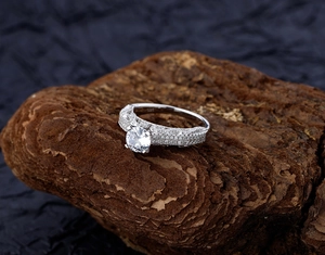 Detailed close-up of S925 sterling silver stamp and sparkling micro-pave diamond ring