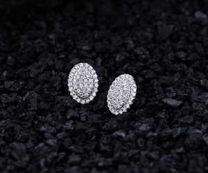 Macro shot of S925 sterling silver oval stud earrings with pavé set cubic zirconia stones