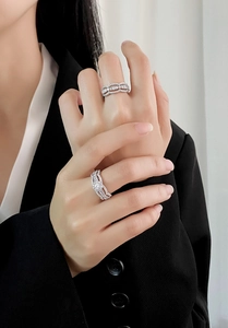 Macro shot of S925 sterling silver interlaced rings with pave-set cubic zirconia stones
