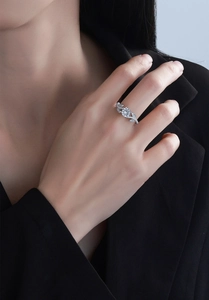 Macro view of S925 sterling silver leaf ring with round zircon and micro-pave details