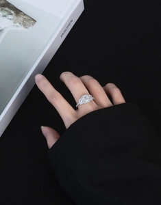 Close-up of S925 sterling silver ring with large emerald cut sparkling main stone