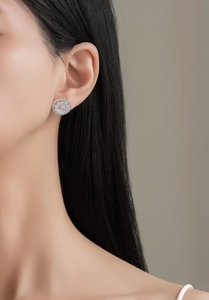 Macro detail of S925 sterling silver flower earrings with pavé micro-set diamonds