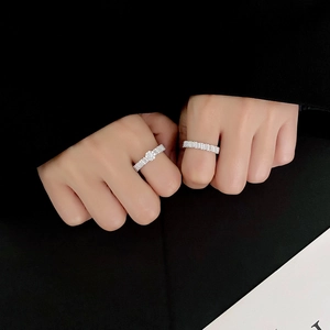 Elegant silver rhumbic diamond wedding band set on finger with minimalist design