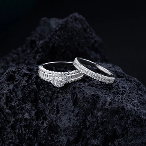 Micro pavé set S925 sterling silver ring set with round and baguette diamonds on volcanic rock