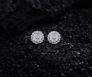 Macro shot of S925 silver double-layered flower earrings with micro-paved crystals