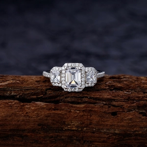 Three-stone emerald cut S925 sterling silver ring with pavé diamonds on the band