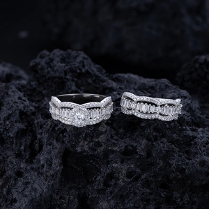 Elegant wavy S925 sterling silver ring set with round moissanite on dark volcanic rock