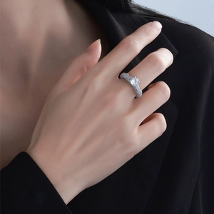 Exquisite S925 silver ring featuring a large round zircon and pavé diamond setting on finger