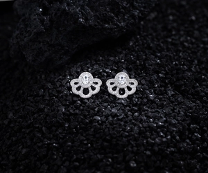 Detailed view of silver fan flower earrings featuring micro-paved cubic zirconia