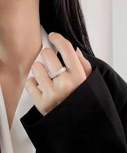 Close-up of S925 sterling silver eternity ring with 5A zircons on a model finger