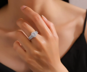 Close-up of S925 sterling silver ring with oval pave zircon on model's hand